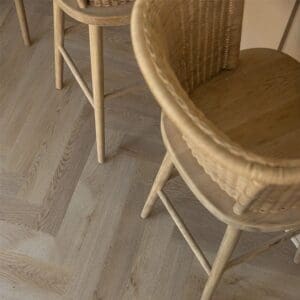 Detailed view of the herringbone pattern and bevelled edges of the Farro planks.