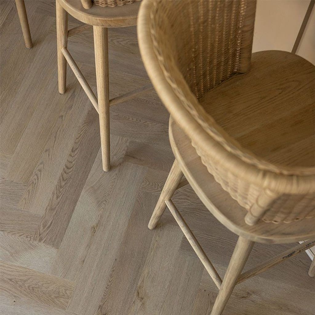 Detailed view of the herringbone pattern and bevelled edges of the Farro planks.