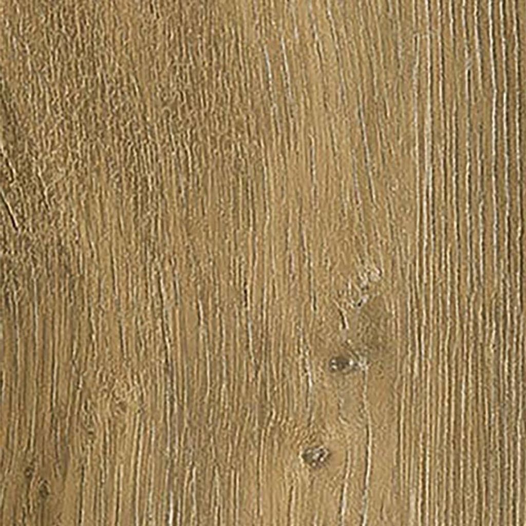 Close up of Flaxen Oak Herringbone flooring next to a wooden table and white sheepskin rug
