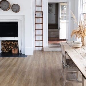 Wide view of Flaxen Oak flooring in a bright living room with a fireplace