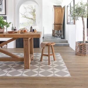 Primary sample of Harvey Maria Flaxen Oak luxury vinyl plank showing vertical grain
