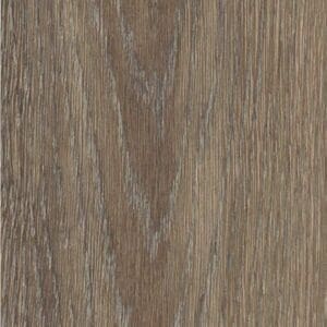 Harvey Maria Garden Oak Herringbone flooring in a rustic living room setting with a wood burner