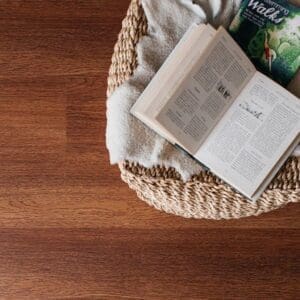 Close up of Harvest Oak flooring with a wicker basket and books to show texture