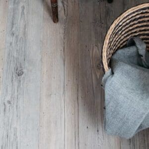 Harvey Maria Hickory wood effect flooring installed in a modern bedroom with a rustic desk