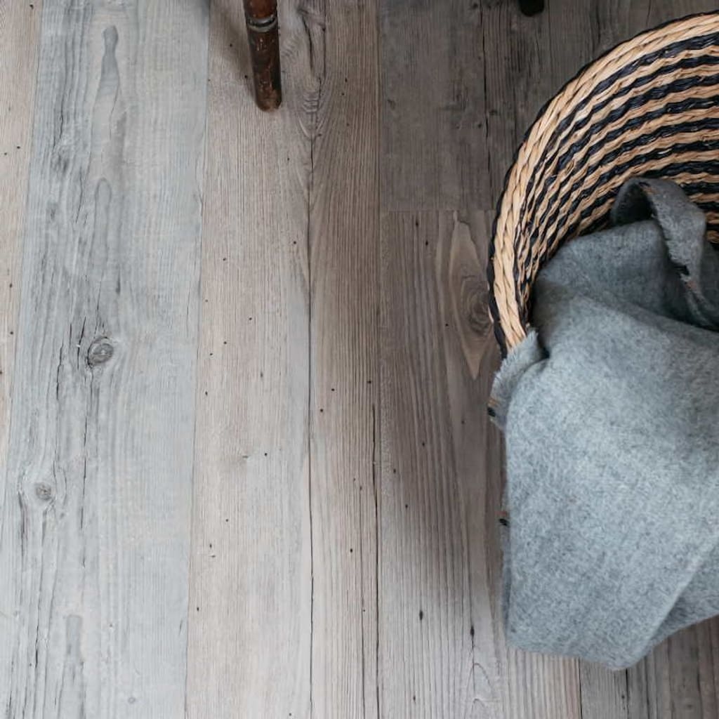 Harvey Maria Hickory wood effect flooring installed in a modern bedroom with a rustic desk