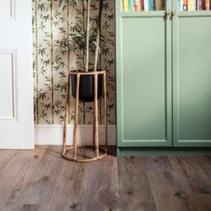 Harvey Maria Highland Natural Plank flooring in a modern living space with green cabinetry