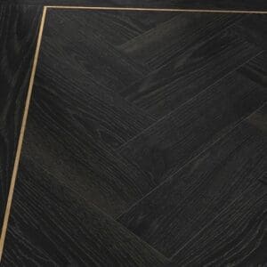 Lamp Oak parquet flooring installed in a herringbone pattern with a gold feature strip