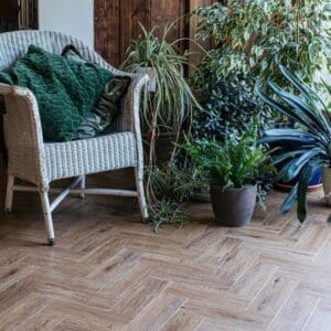 Close up of a limed oak parquet luxury vinyl tile showing wood grain texture