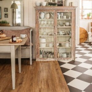 Interior view of a kitchen featuring Harvey Maria Limed Oak wood effect flooring