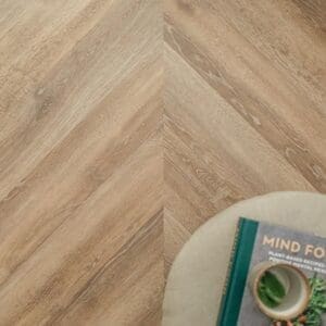 Detailed view of the wood grain surface finish on Dormouse Chevron luxury vinyl tile
