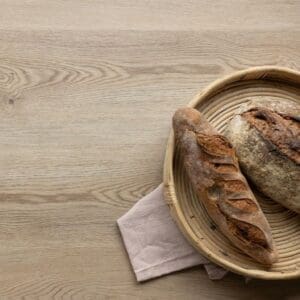 Overhead view of Wicker Plank flooring with a rustic wooden stool