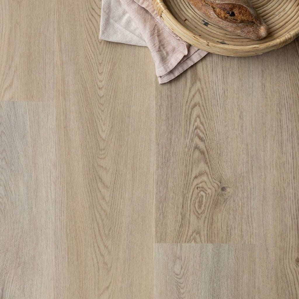 Wide angle view of a luxury kitchen featuring Harvey Maria Wicker Plank flooring