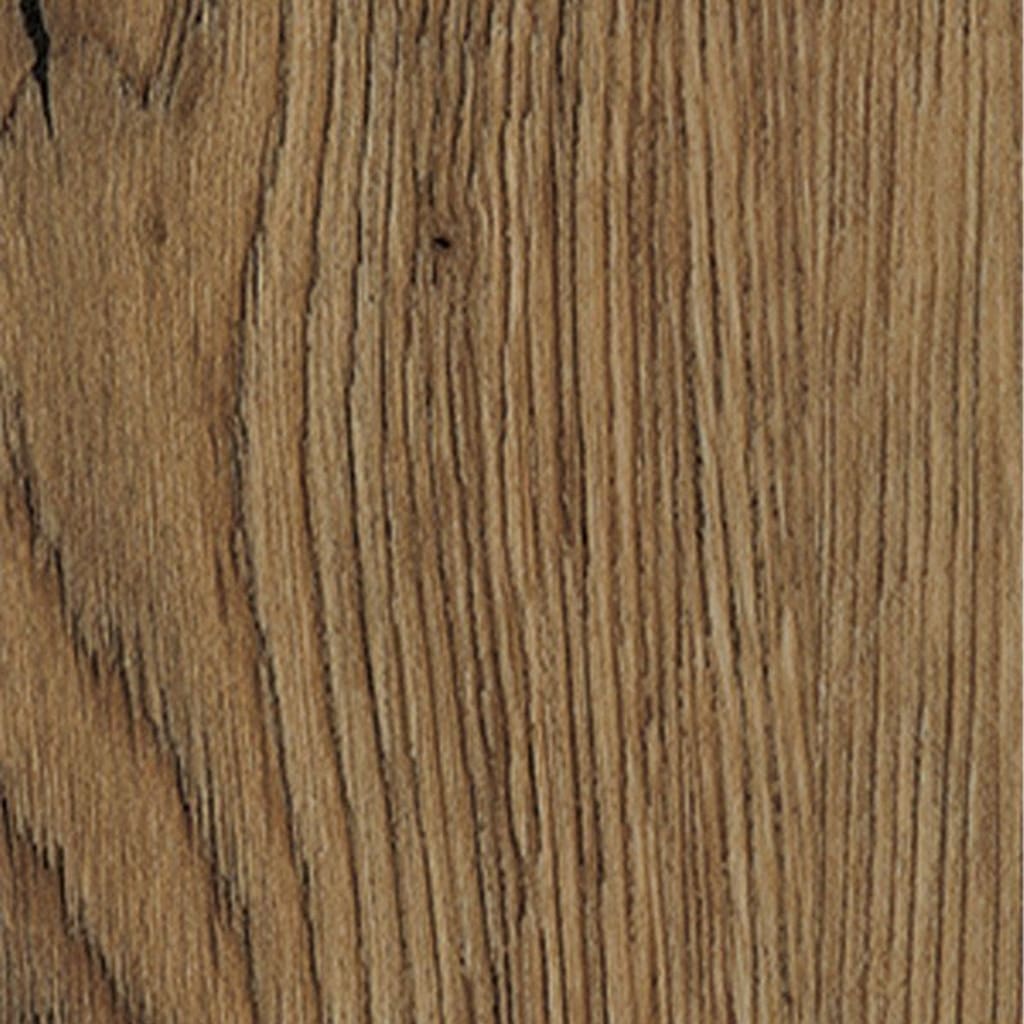 Harvey Maria Mulberry Herringbone flooring installed in a room with a wooden stool and book