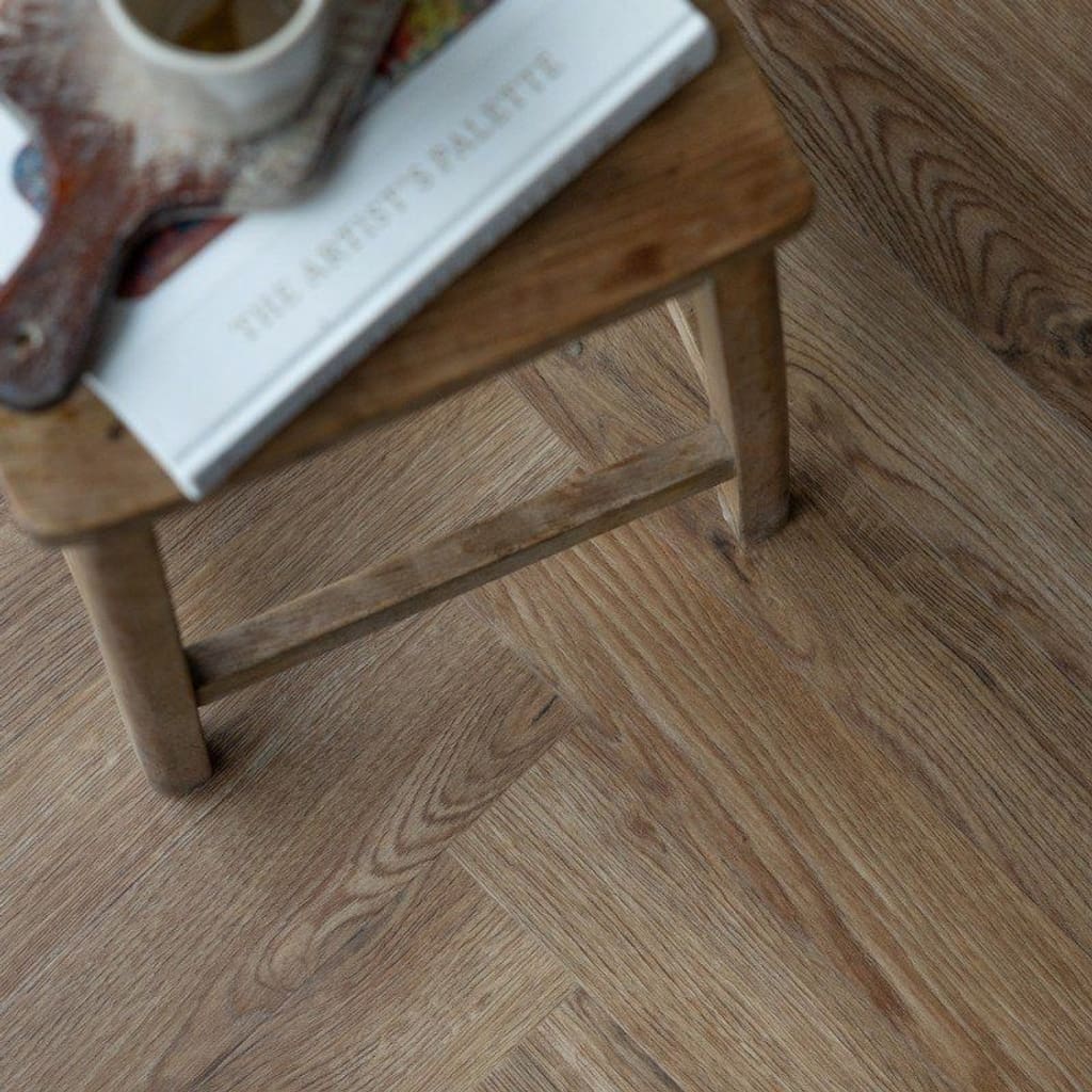 Mulberry Herringbone LVT flooring in a lifestyle setting with a small wooden table