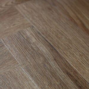 Direct overhead view of a single Mulberry Herringbone plank showing detailed oak grain