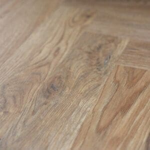 Mulberry Parquet laid in a herringbone pattern under a chair