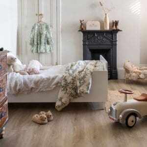Close up of Oast Plank flooring showing wood grain texture next to a toy car