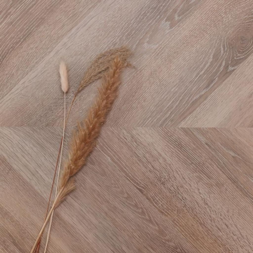 Detailed view of the wood grain surface finish on Old Bramble Chevron flooring