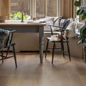 Close up view of Pale Rattan LVT planks showing wood grain texture