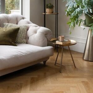 Wide view of Pippin Parquet flooring installed in a modern interior with biophilic design elements