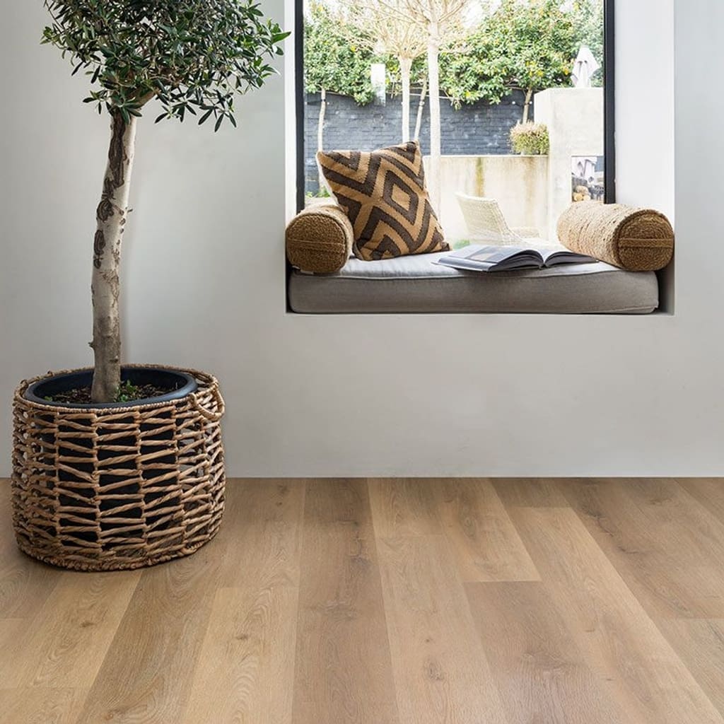 Harvey Maria Rattan Plank flooring in a bright room with a window seat and large potted plant