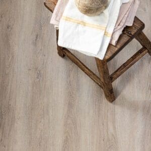Rosehip wood effect LVT installed in a modern bathroom with grey marble tiles