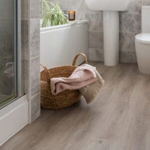 Overhead view of Rosehip wood effect planks with bread and kitchen accessories