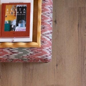 Harvey Maria Rowan Plank paired with a geometric patterned tile in a dining room setting.
