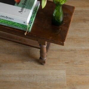 Detailed view of Sorrel Plank LVT with furniture leg