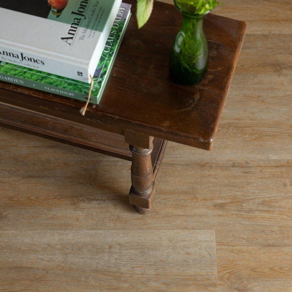 Detailed view of Sorrel Plank LVT with furniture leg