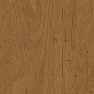 Harvey Maria Sussex Oak Plank flooring installed in a living room with a green plant in the foreground