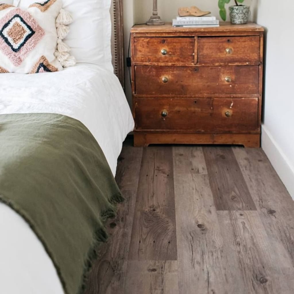 Harvey Maria Tythe wood effect flooring installed in a bright modern bedroom