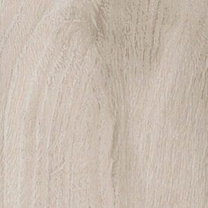 Harvey Maria White Oak Parquet flooring installed in a bathroom next to a green roll-top bath