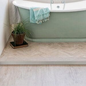 Close up of the realistic wood grain texture on a White Oak Parquet luxury vinyl tile