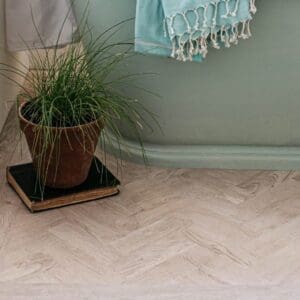 Detail view of Harvey Maria White Oak Parquet showing the transition between herringbone and plank patterns