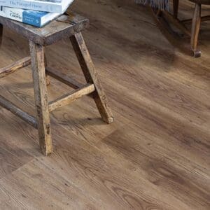 Detailed view of the reddish brown wood effect planks in a home setting