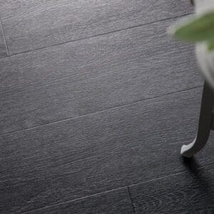 Overhead view of Lamp Oak wood effect plank sample showing dark grain
