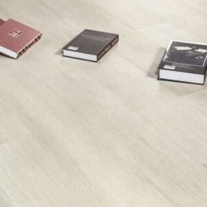 Close up of Almond Birch planks with books showing the realistic wood effect texture
