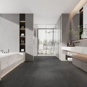 Modern luxury bathroom featuring dark anthracite stone effect flooring