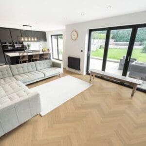 Spacious modern living room and kitchen featuring Austrian Larch herringbone flooring