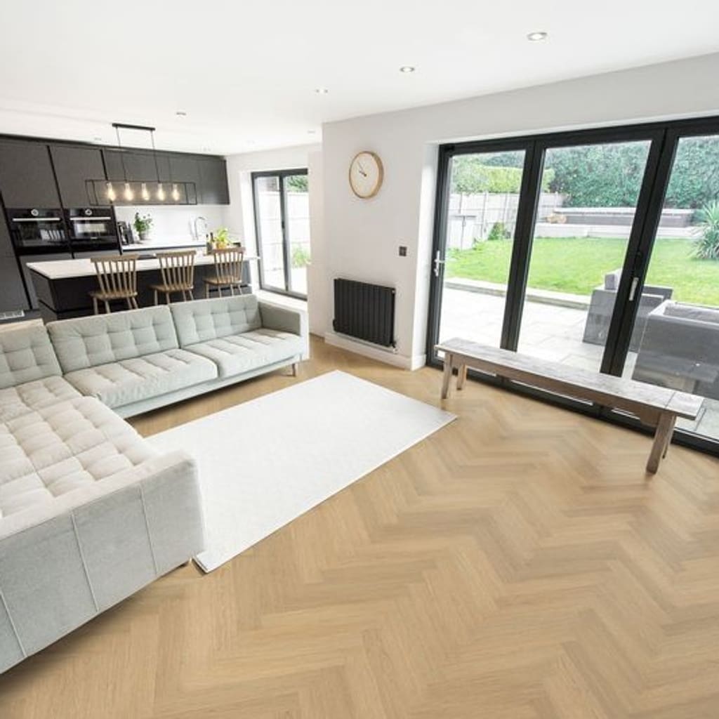 Spacious modern living room and kitchen featuring Austrian Larch herringbone flooring