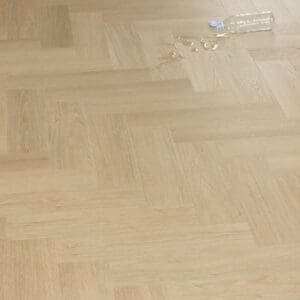 Water spill on Austrian Larch flooring demonstrating moisture resistance