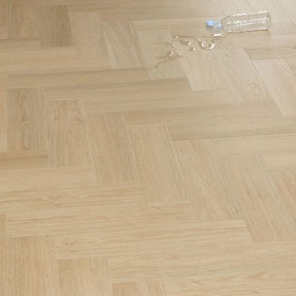 Water spill on Austrian Larch flooring demonstrating moisture resistance