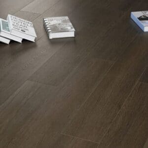 Close up detail of Bourbon Walnut LVT planks showing the realistic wood texture and thickness