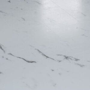 Angled perspective of white marble effect vinyl tiles with soft light reflection