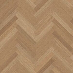 Top down view of Montana Oak luxury vinyl in a herringbone pattern showing warm honey tones