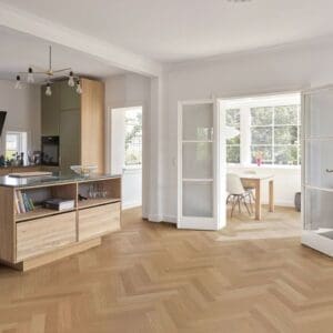 Modern kitchen and dining area featuring Montana Oak herringbone flooring