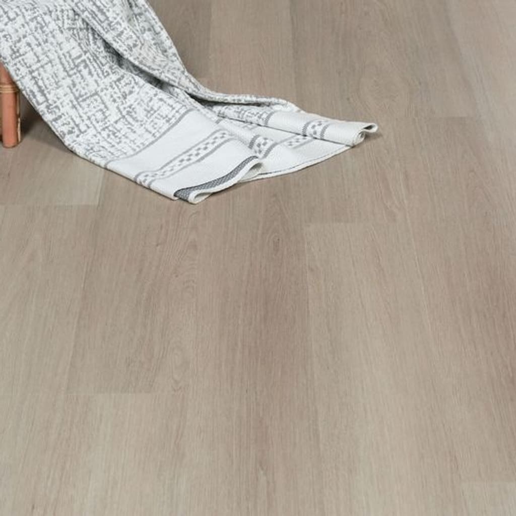 Oregon Ash flooring with a decorative blanket and chair leg in a home setting