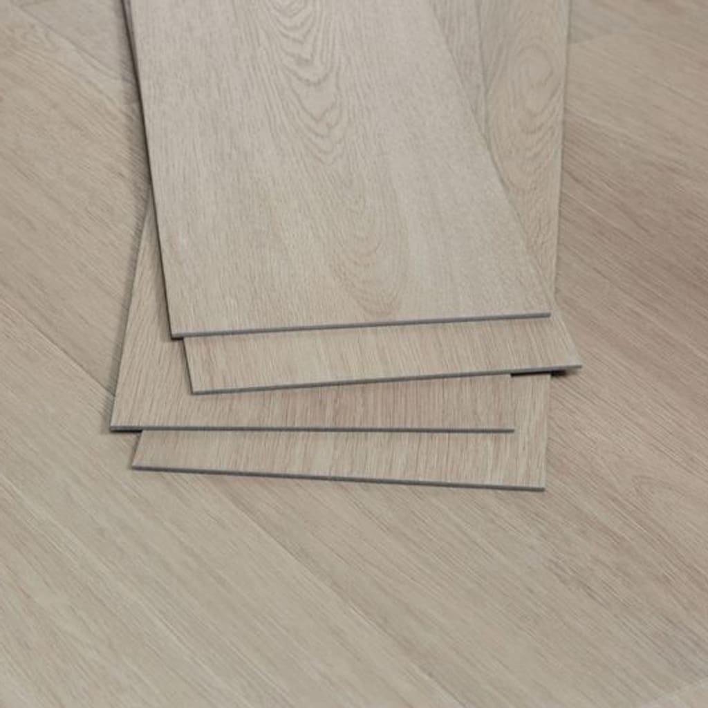 A stack of Nordikka Naturals Oregon Ash vinyl planks showing thickness and edge detail
