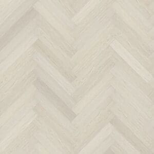 Top down view of Pale Birch herringbone luxury vinyl flooring showing light wood tones